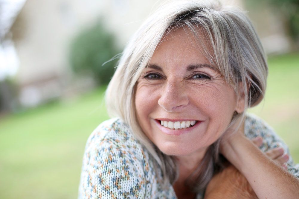 A woman with a beautiful and healthy smile
